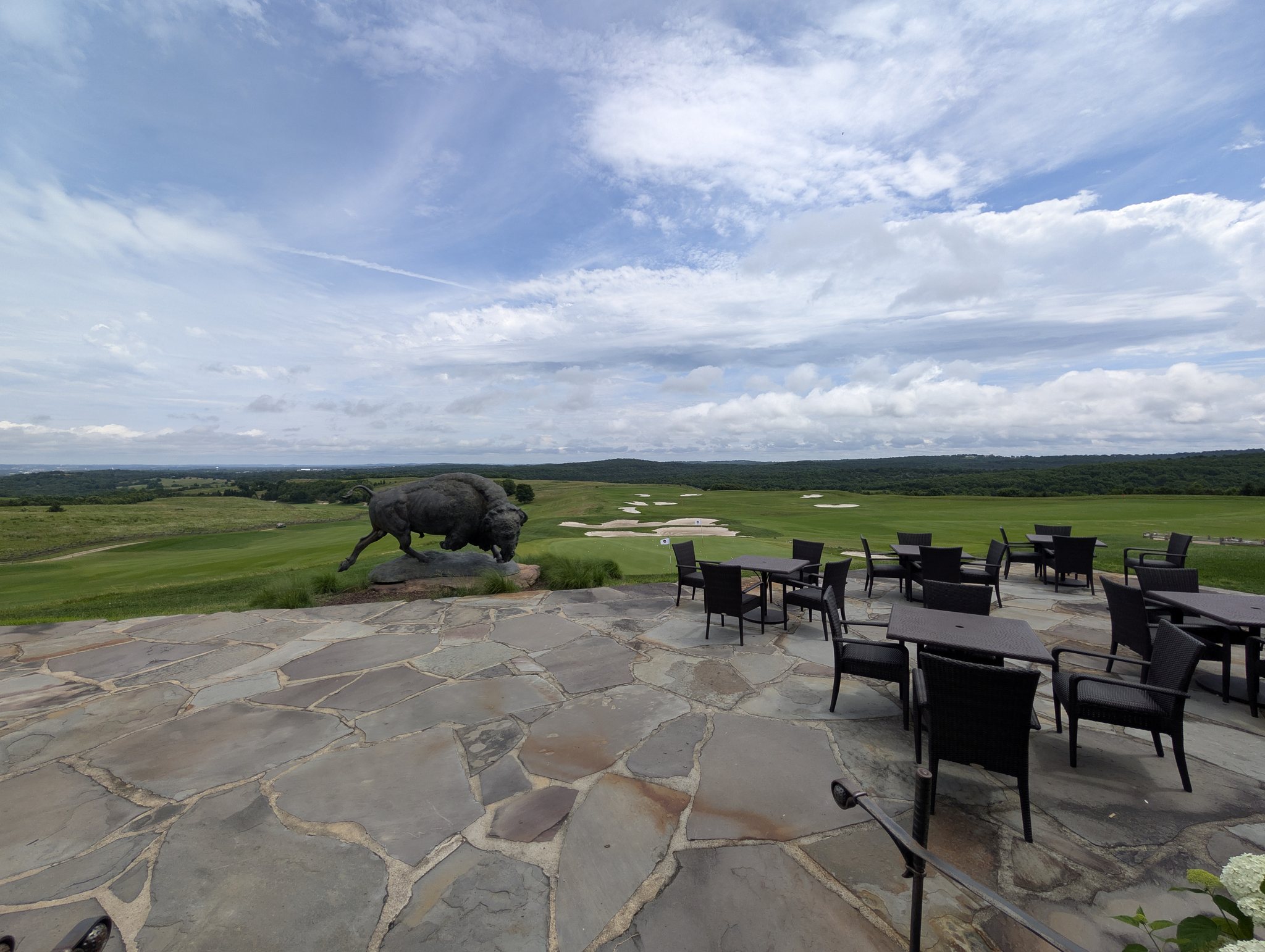 Buffalo Ridge patio with charging buffalo statue overlooking the golf practice facility near Branson, Missouri
