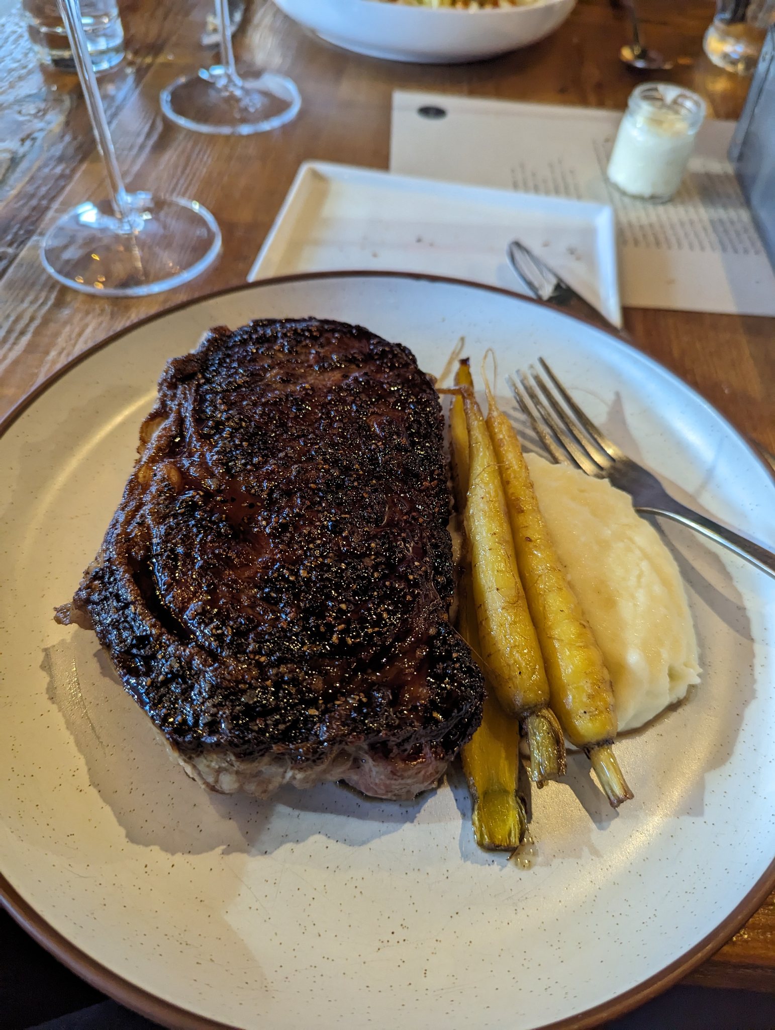 Steak dinner with roasted carrots and mashed potatoes at Brazen Open Kitchen in Dubuque Iowa