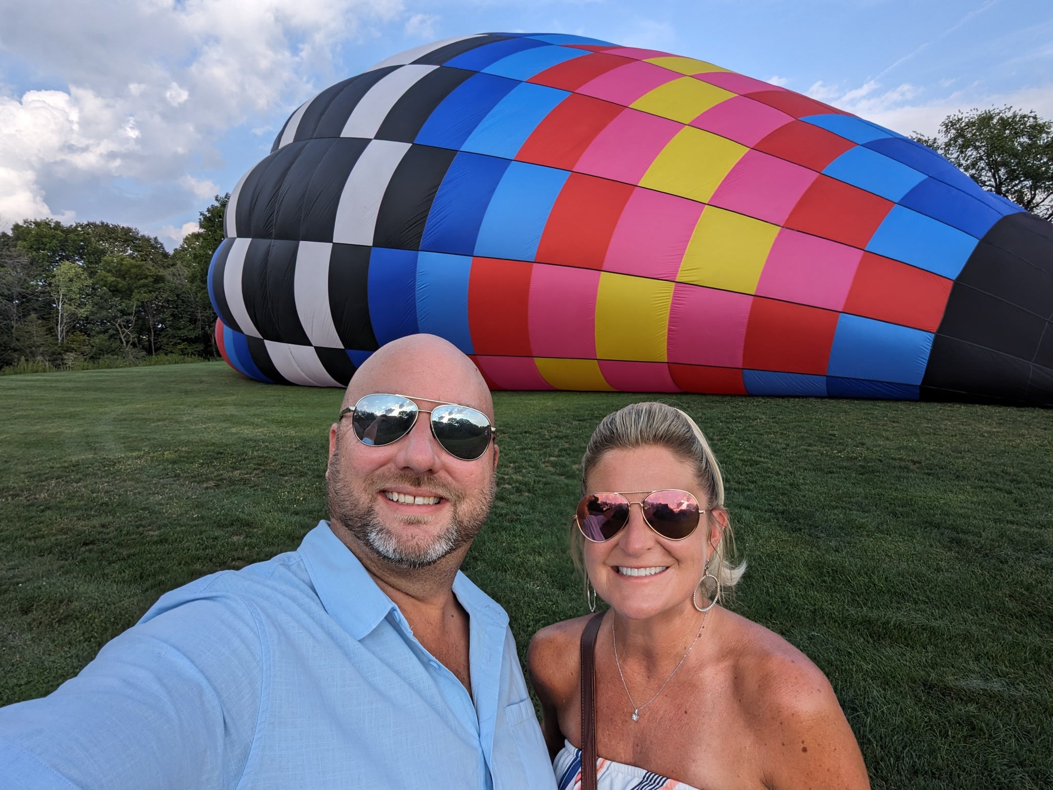 Couple selfie beside a hot air balloon being inflated near Galena Illinois
