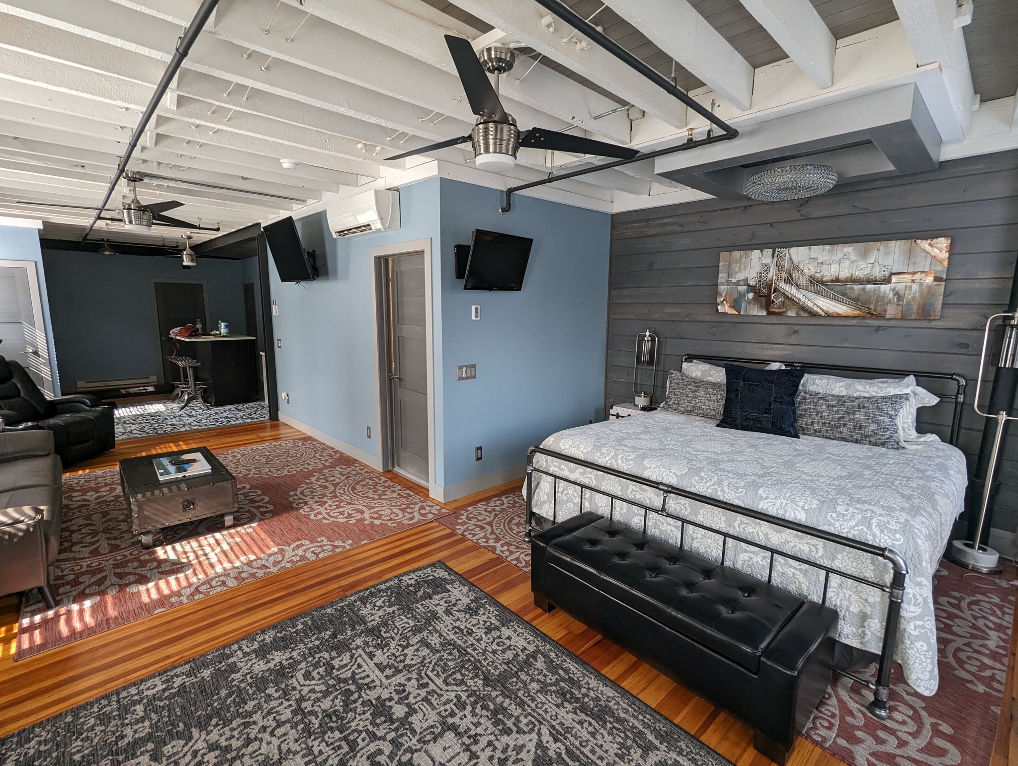 Open-concept loft bedroom and living space at Suite Victory Airbnb in Galena Illinois