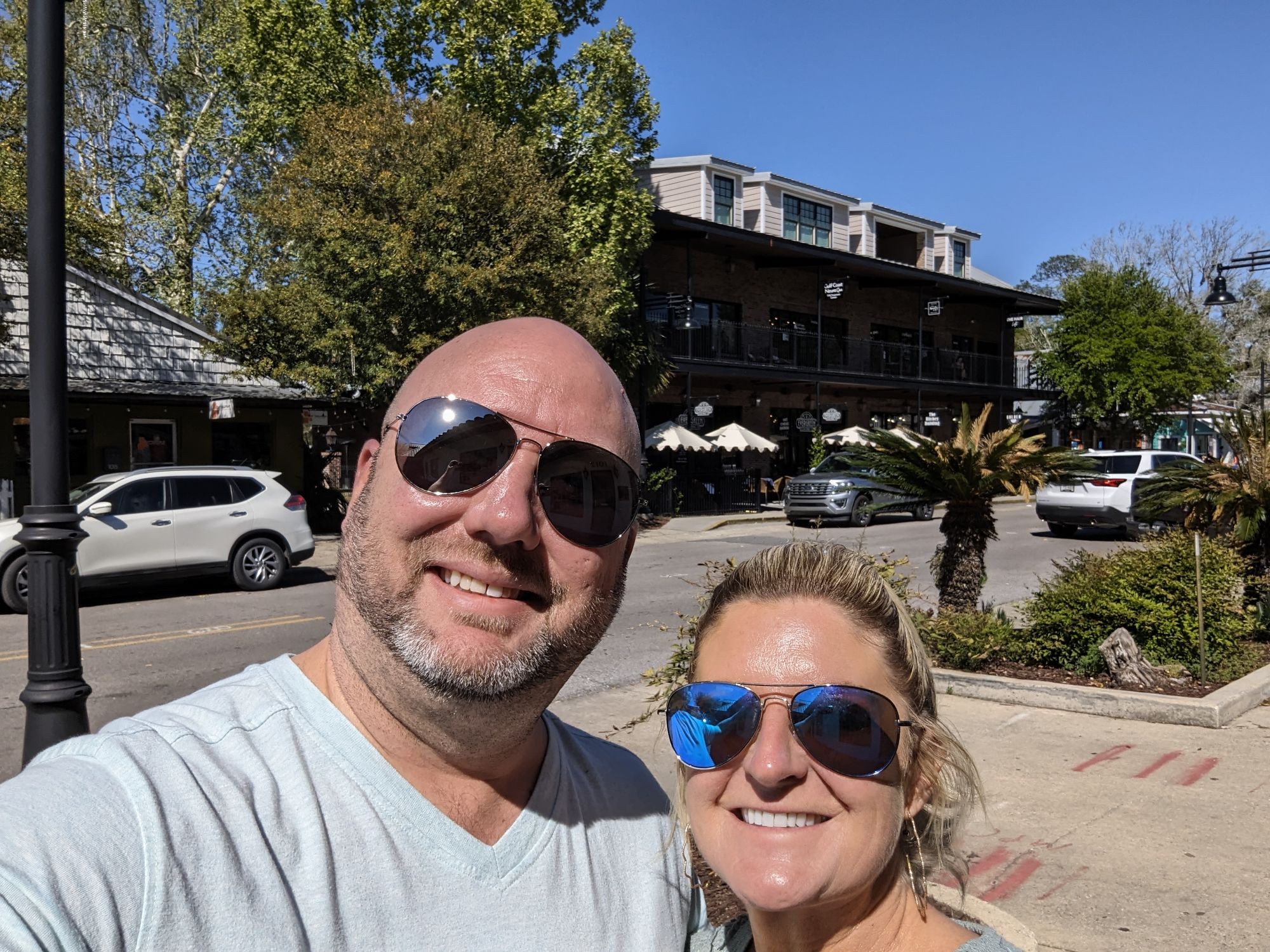 Kelli and me on a downtown Ocean Springs sidewalk under the live oaks