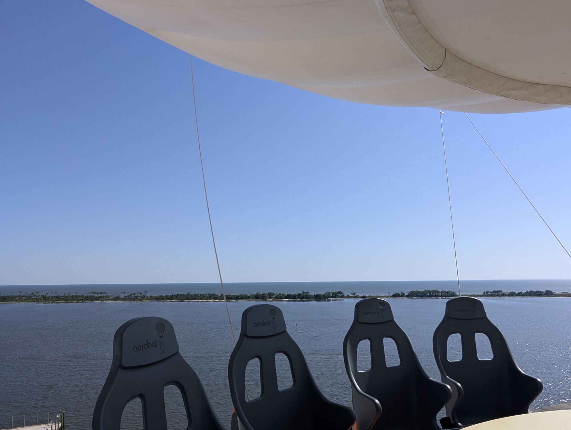 Aerobar seats overlooking Deer Island and the Gulf at Paradise Pier Fun Park in Biloxi