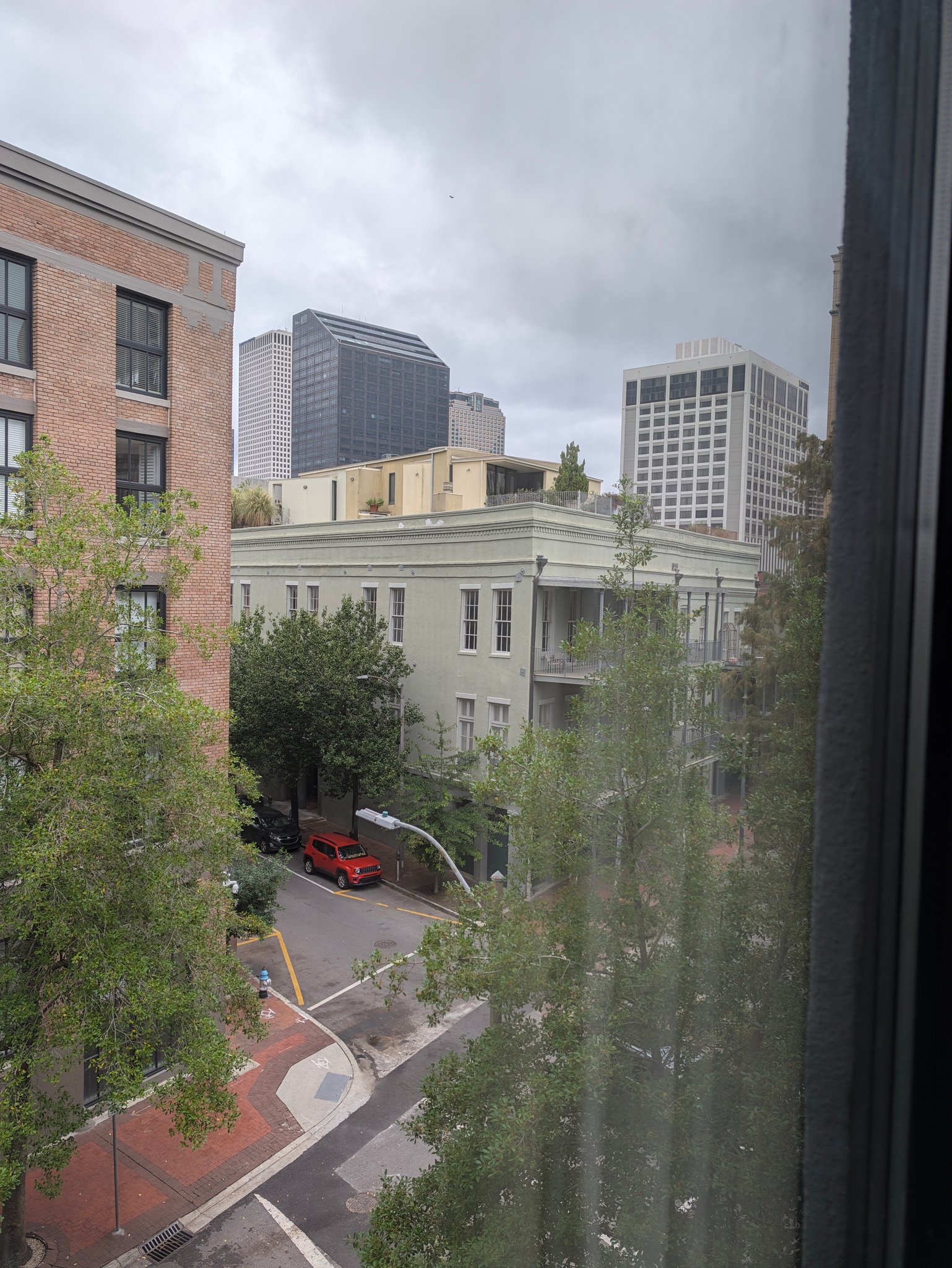 View of the street and downtown New Orleans buildings from a Riverfront Hotel window