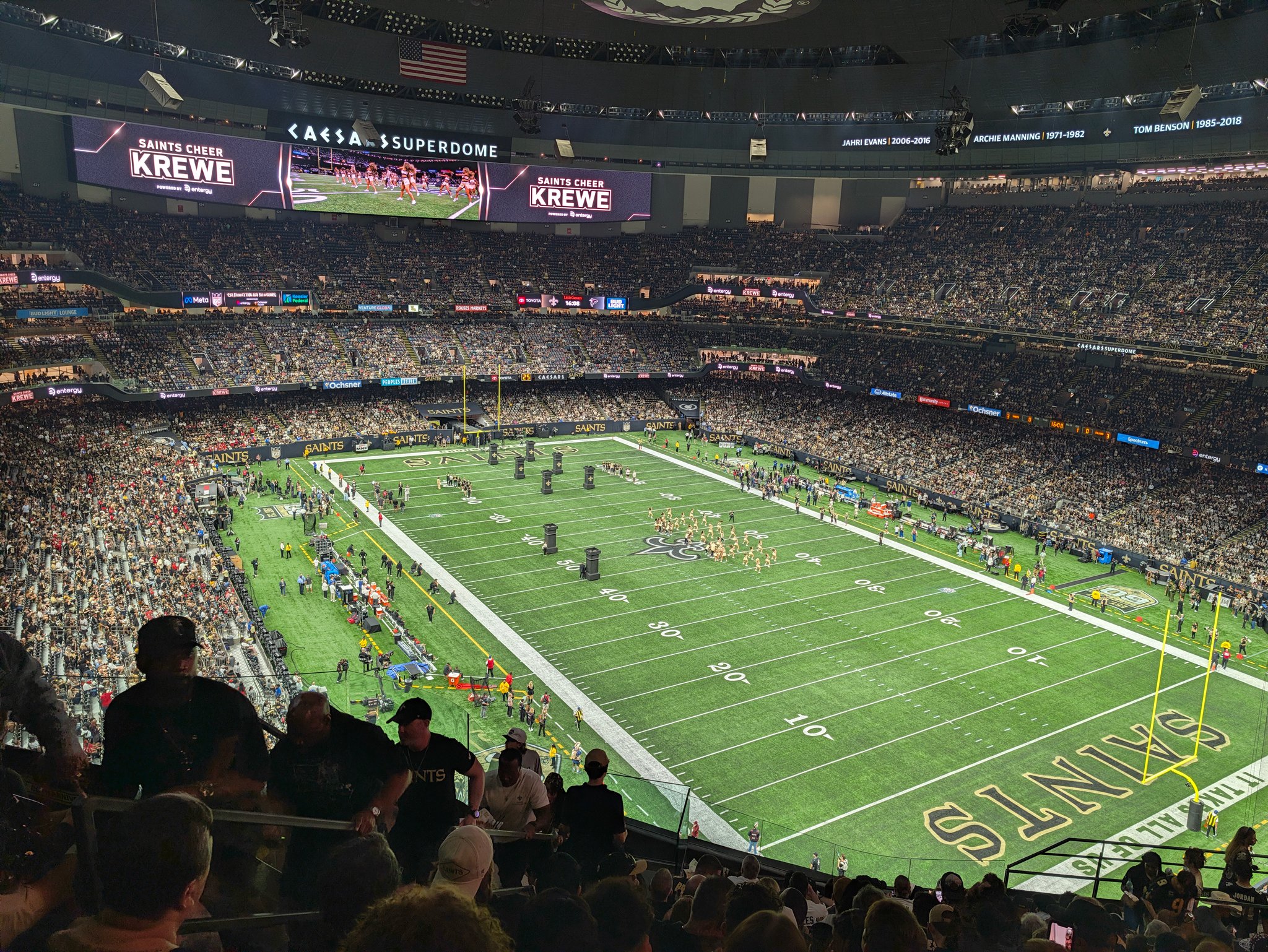Crowd watching a New Orleans Saints game from the upper seats inside the Caesars Superdome